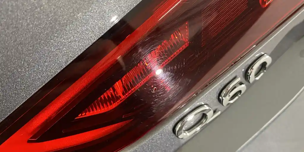 Faded red tail light lens
