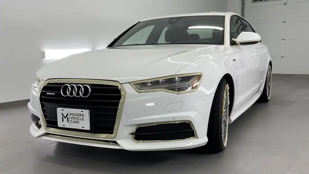 White Audi A6 in the white studio bay