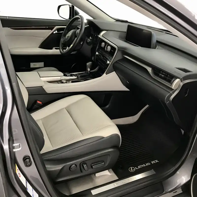 Lexus RX interior with light leather seats after detailing