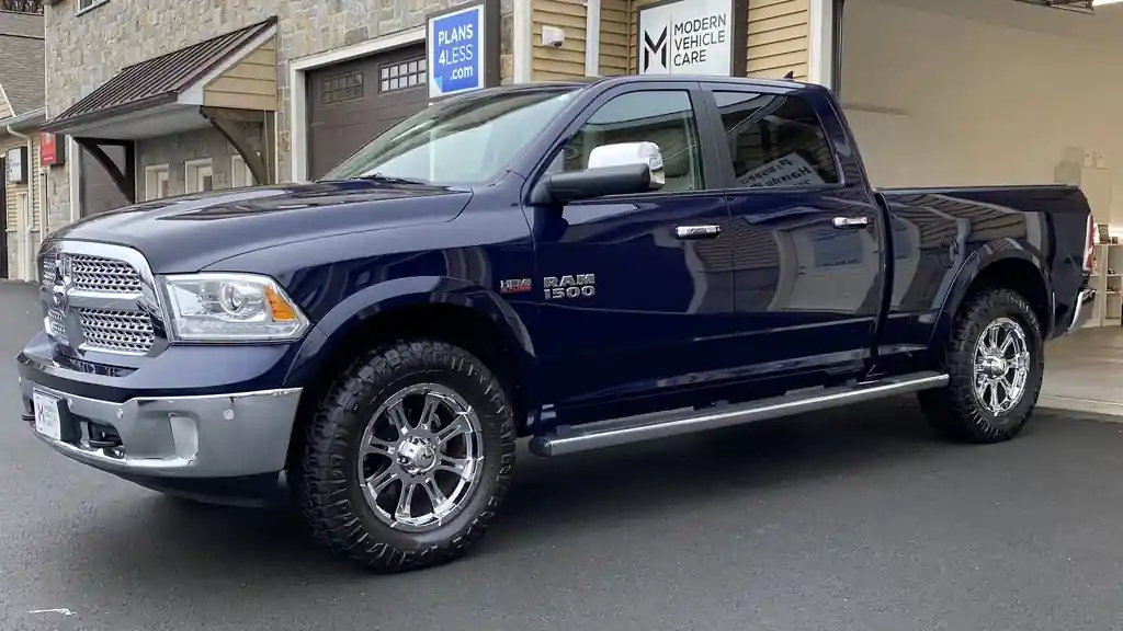Navy Ram 1500 crew cab with chrome wheels outside the Union City Road building